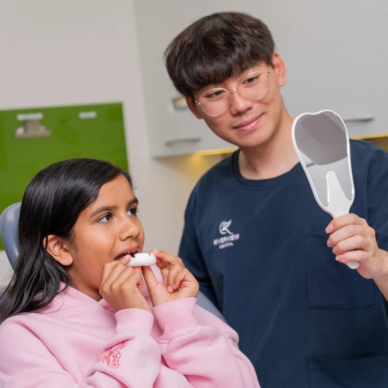 dr michael huynh helping child with mouthgaurd riverview dental shepparton vic 116