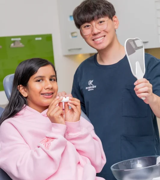 dr michael huynh helping child with mouthgaurd riverview dental shepparton vic 119